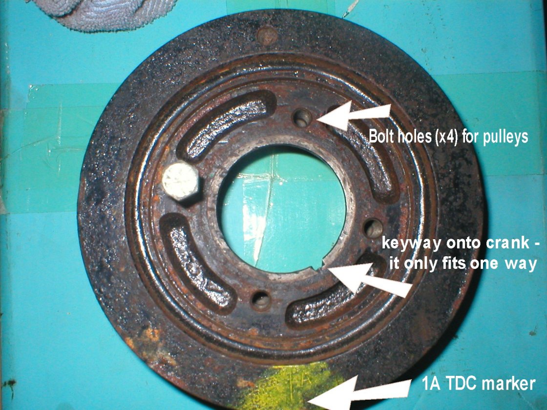 note the orientation of the four central bolt holes for the pulley relative to the 1A mark at 6 o'clock.JPG